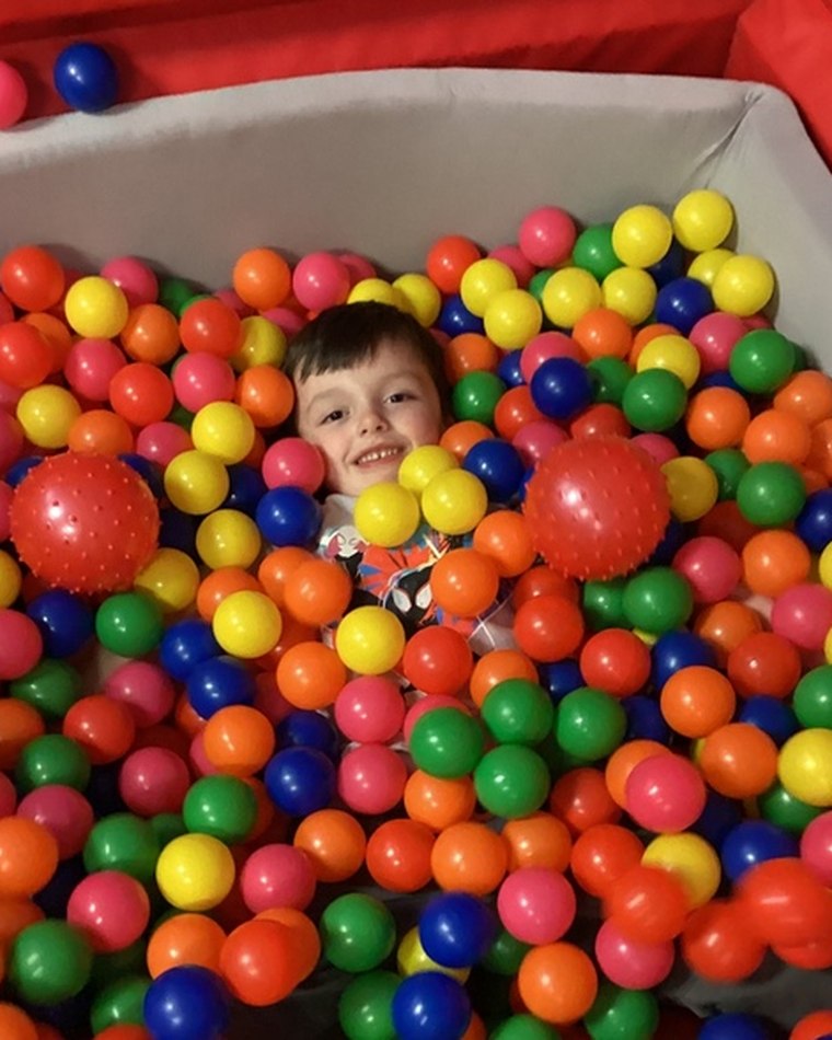 A child enjoying paint and messy play at Chatter Splatter Daycare